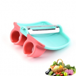 two finger fruit and vegetable peeler